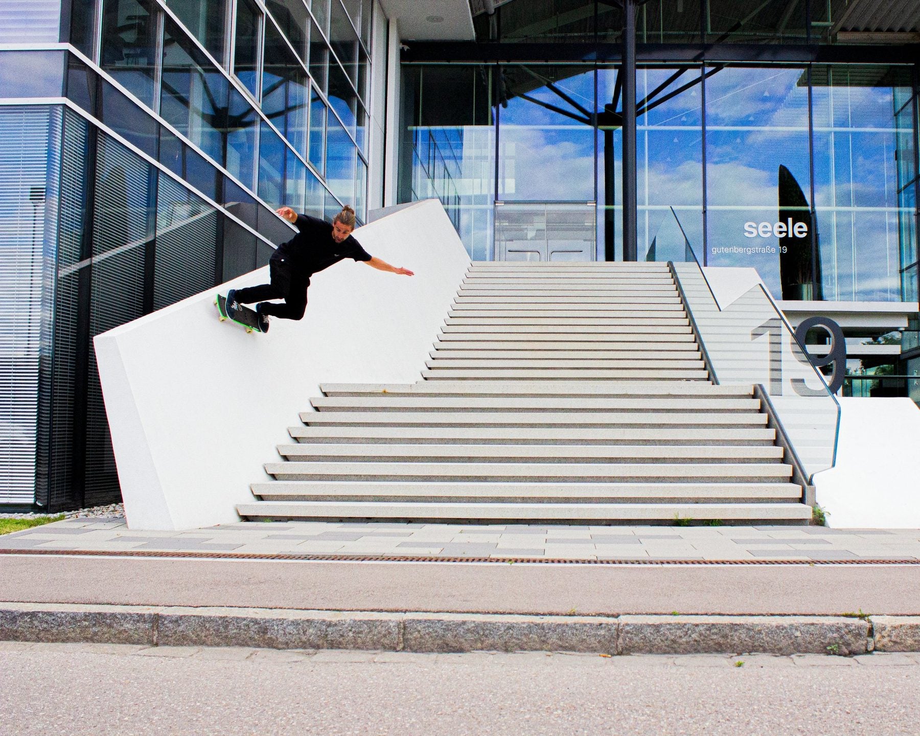 Skater doing a wallride on Avenue suspension trucks